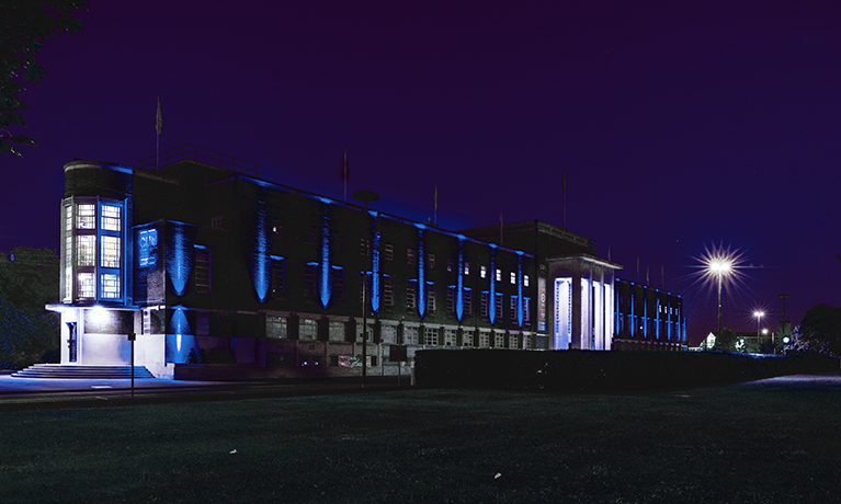 CU London lit up with blue lights as part of the 'clap for carers' tribute