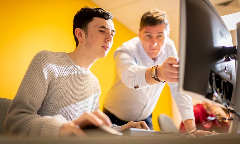 Student looking at a monitor 