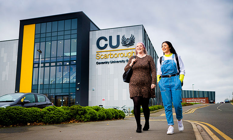 Two students standing outside CU Scarborough building 