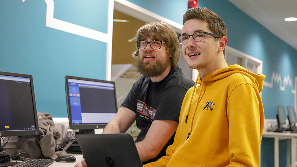 Two Computing Science students as a computer