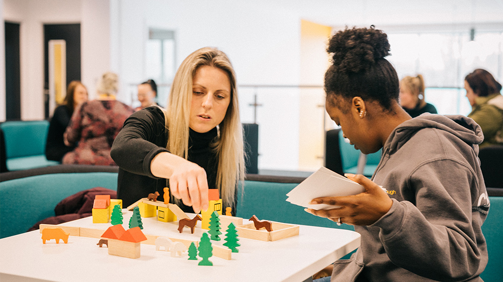 Two women training for childhood learning and development