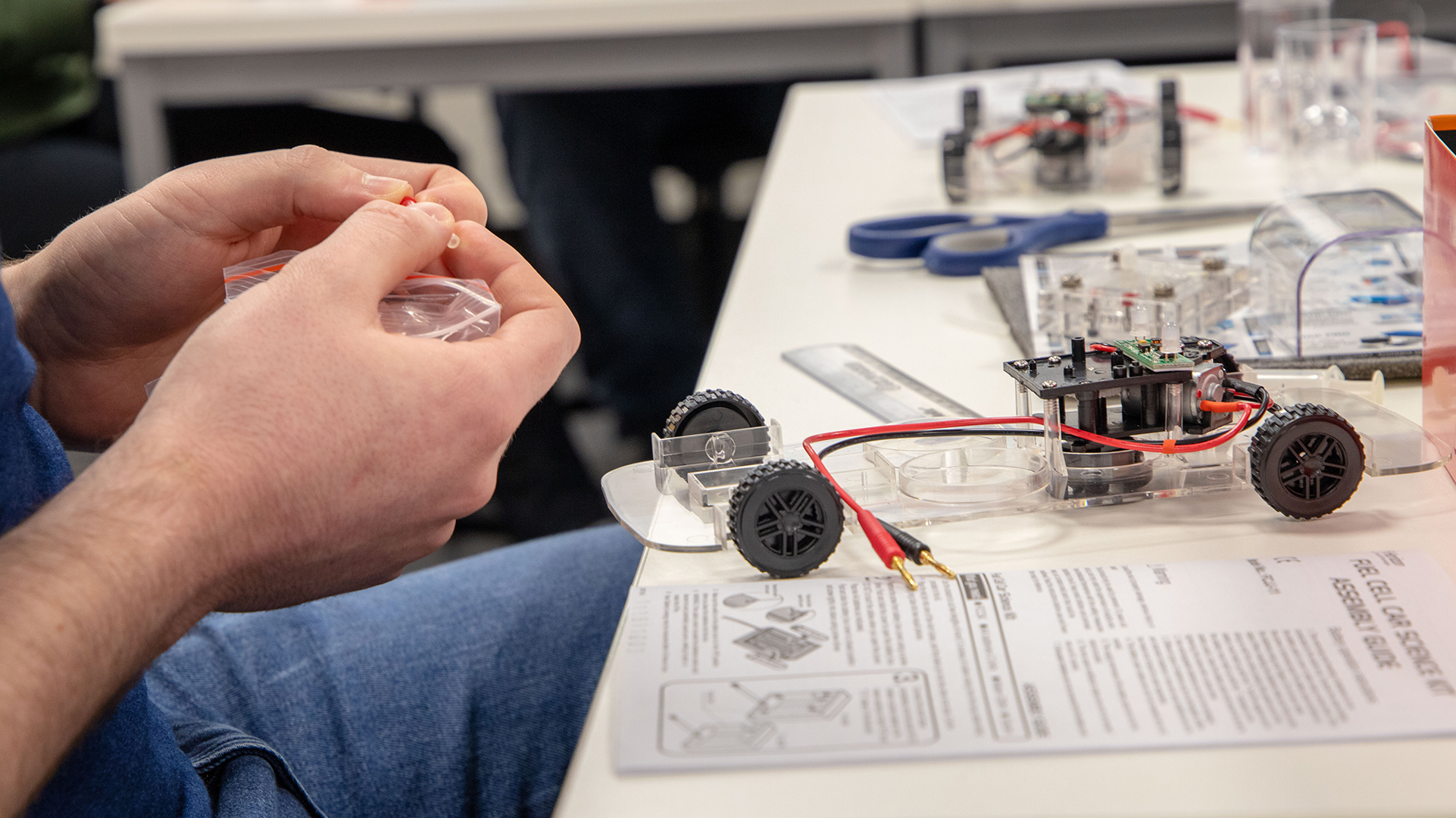 Engineering student wiring their project