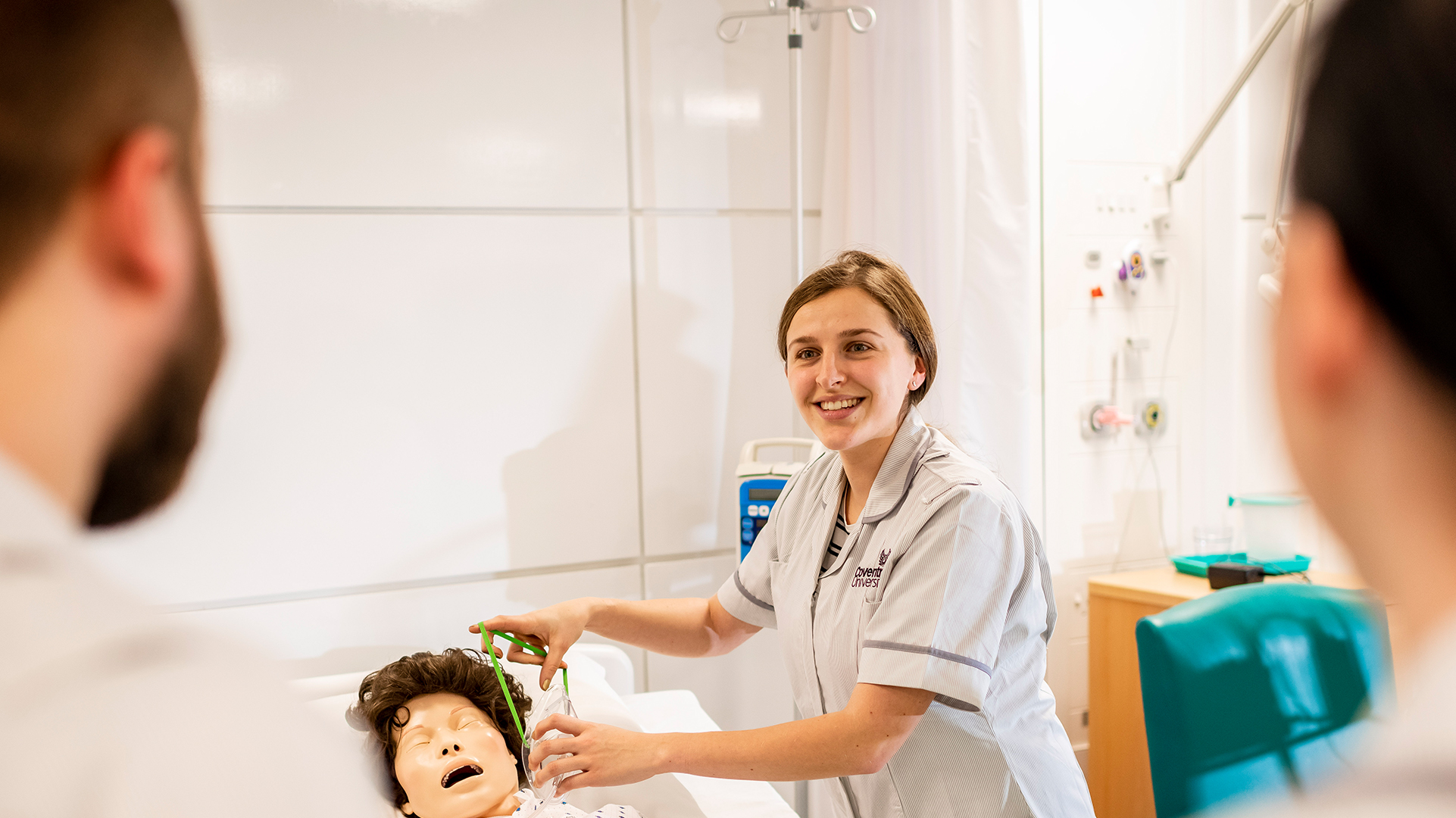 Health & Social Care students using a dummy
