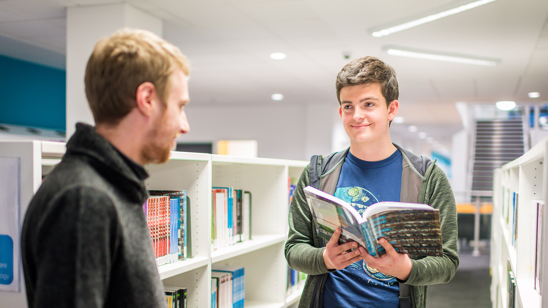 Two Law and Practice students in discussion in the library