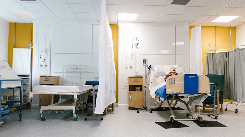 Two patient beds in a nursing environment