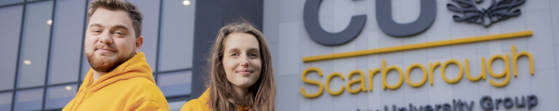 Two students stood outside the CU Scarborough building smiling