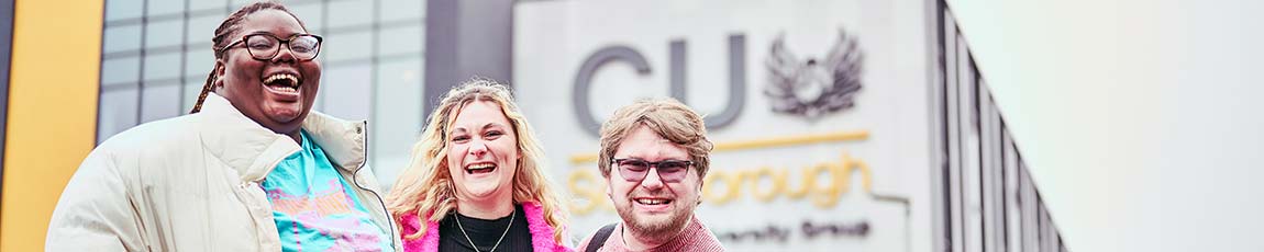 Three students stood outside of the CU Scarborough building