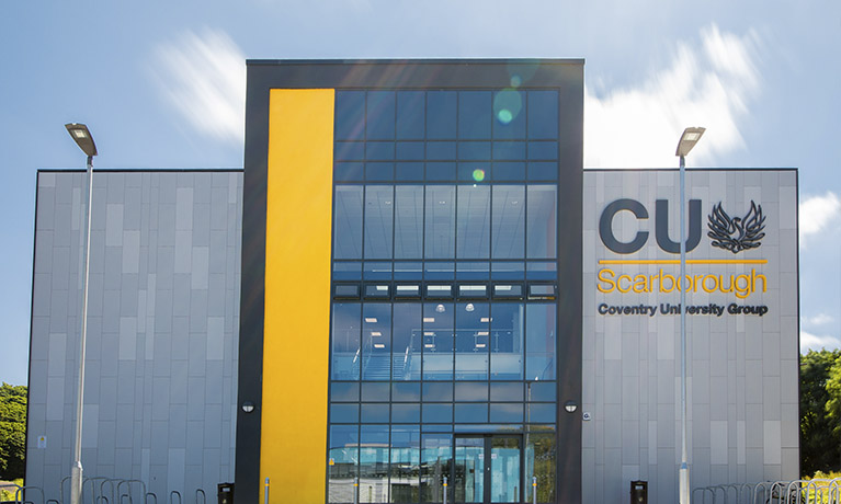 Outside of the CU Scarborough building on a sunny day
