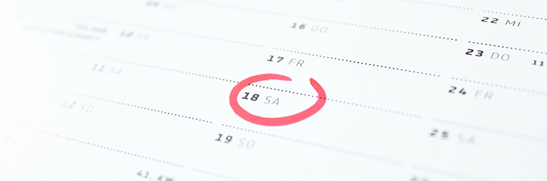 printed calendar with a date circled in red