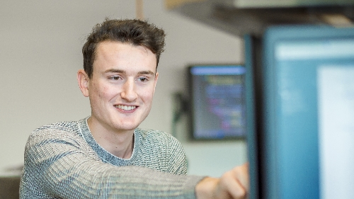 Cloud Computing student using a computer