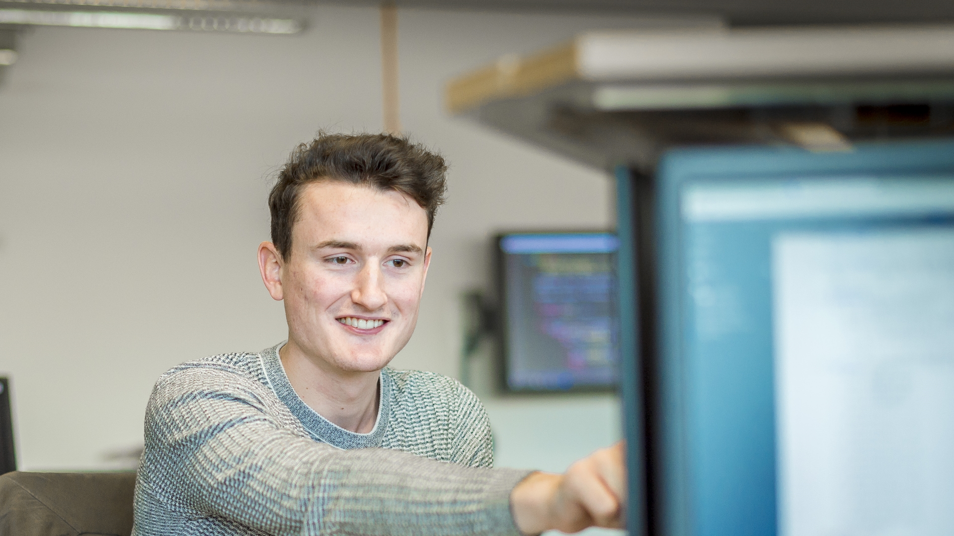 Cloud Computing student using a computer