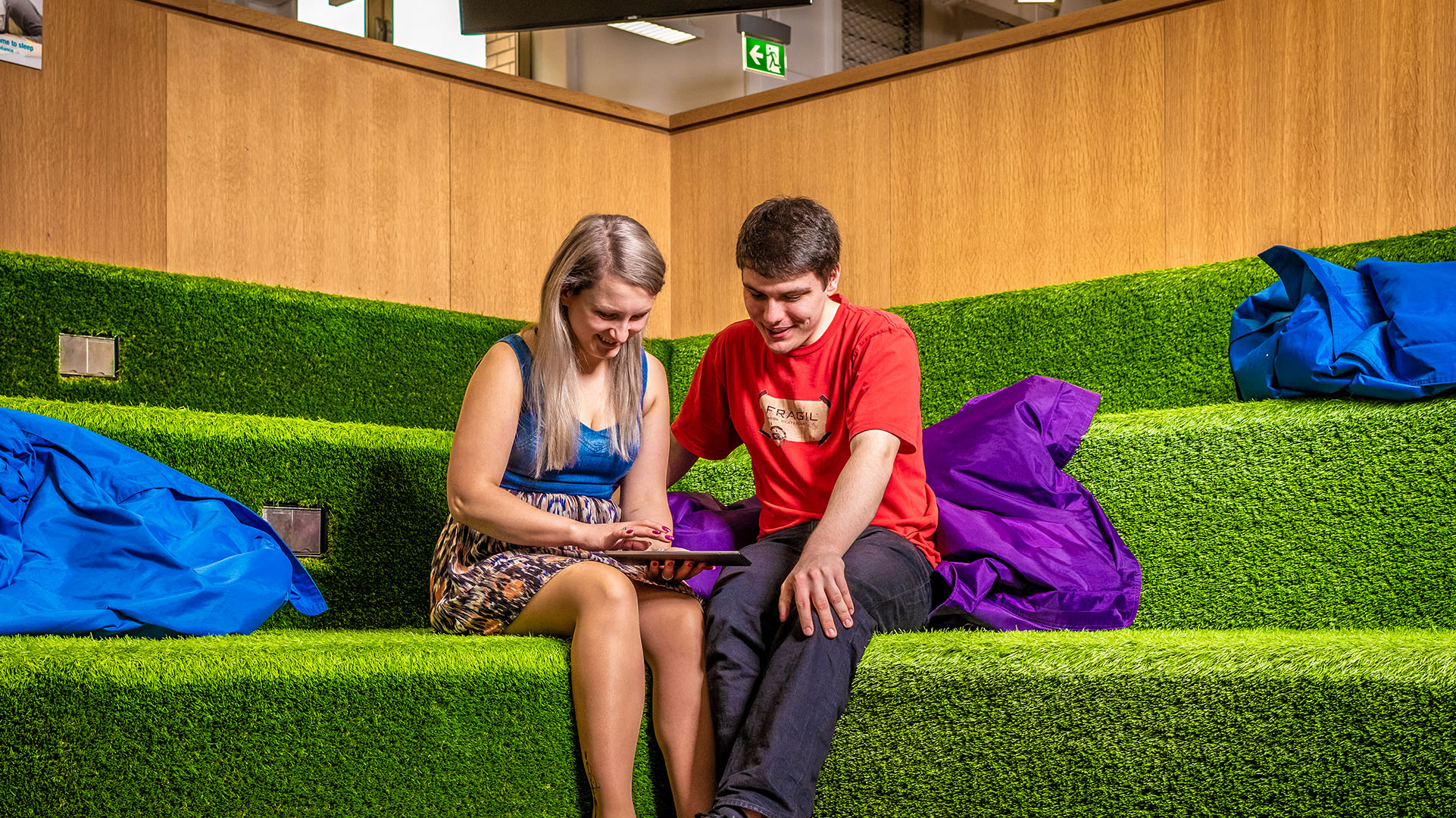 Health, Education and Wellbeing students using a tablet in a specialised classroom