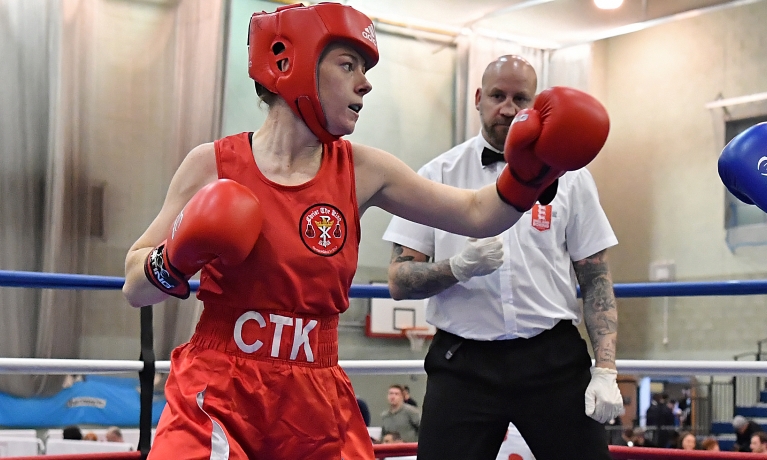 Male in a boxing ring wearing mid punch