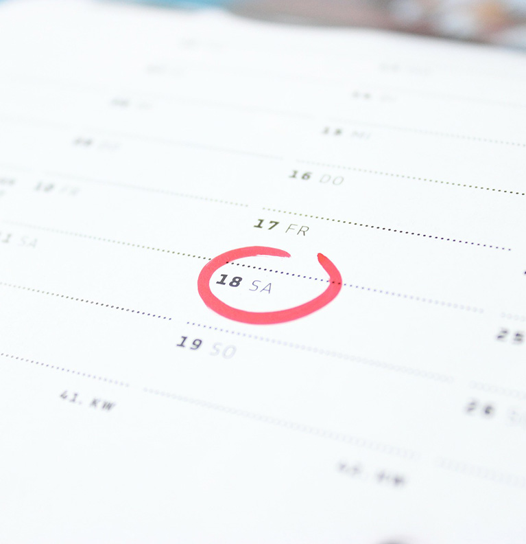 printed calendar with a date circled in red