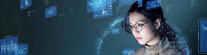 Female working on her laptop with various digital windows surrounding her