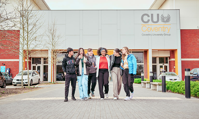 Group of students walking away from the CU Coventry building