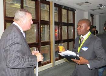 Two business people talking at a networking event.