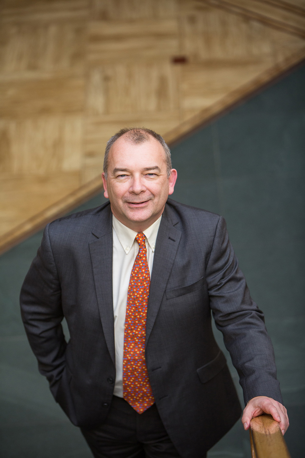 VC John Latham portrait stood at the bottom of a staircase