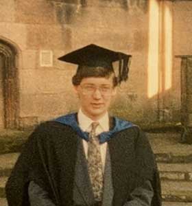 Mark Howarth in his graduation gown, at Coventry Cathedral