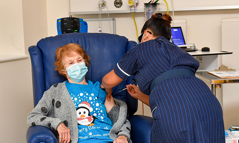 Margaret Keenan, 90, receives the Pfizer/BioNtech covid-19 vaccine at University Hospital, Coventry, administered by nurse May Parsons