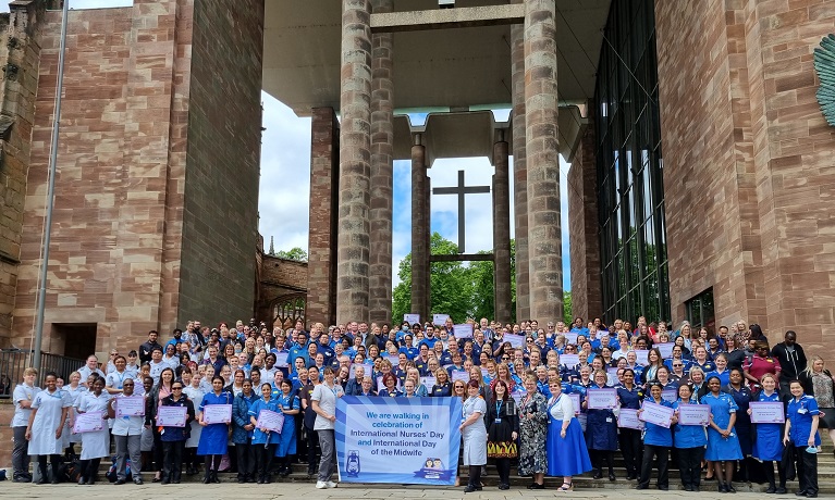 Past, present and future Nurses, Nursing Associates and Midwives celebrating International Nurses' Day and International Day of the Midwife at Coventry Cathedral