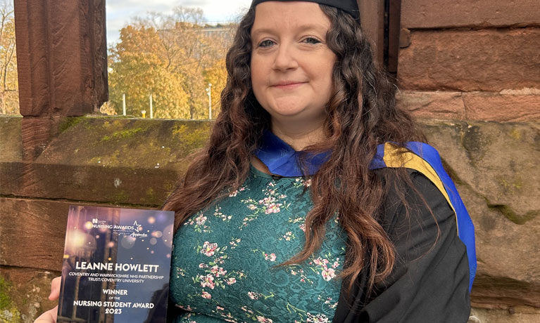 Leanne Howlett holding her award.