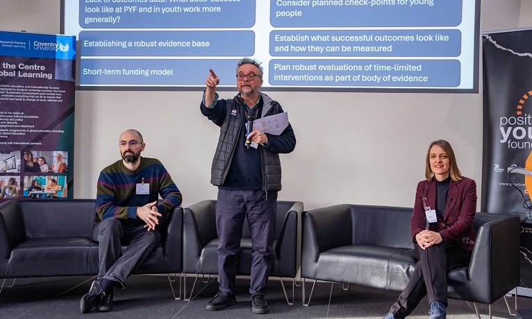 Researchers from Coventry University's Centre for Global Learning joined on-stage by executive director of Positive Youth Foundation