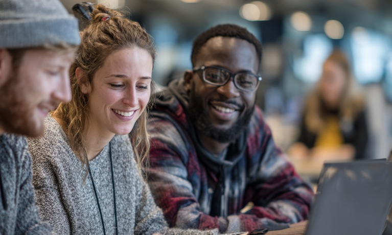 Students around a laptop