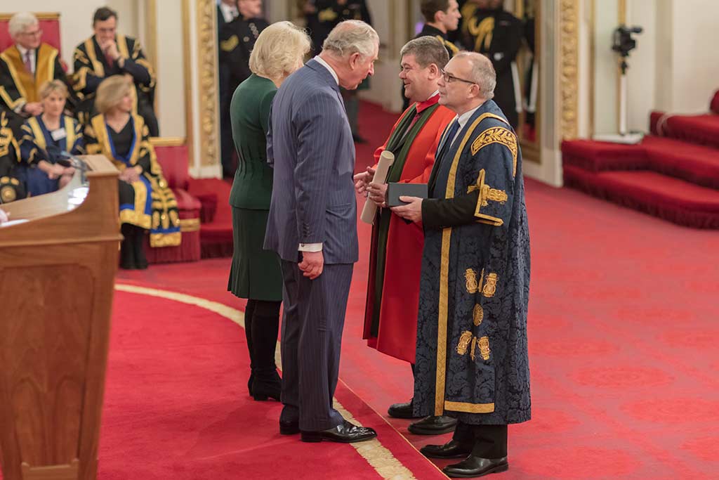 John Latham and Carl Perrin being awarded a queens prize for AME
