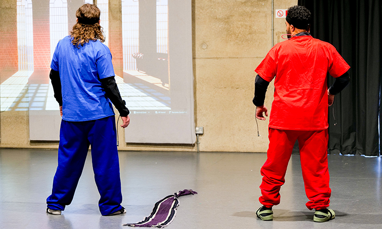 young people in inclusive immersive performance red and blue costume