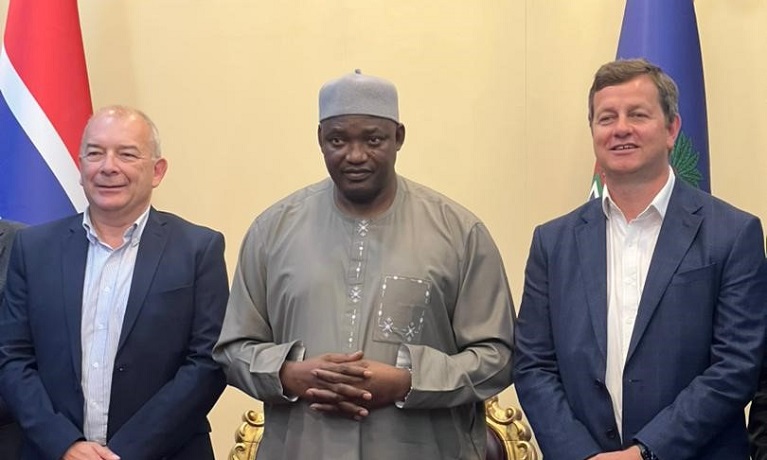 Coventry University Vice-Chancellor, Professor John Latham CBE, and Pro-Vice-Chancellor (International), Richard Wells. stand either side of the President of The Gambia, Adama Barrow.