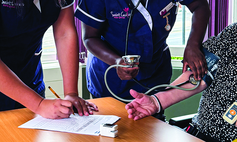 St Cecilia's nurses training on how to take blood pressure