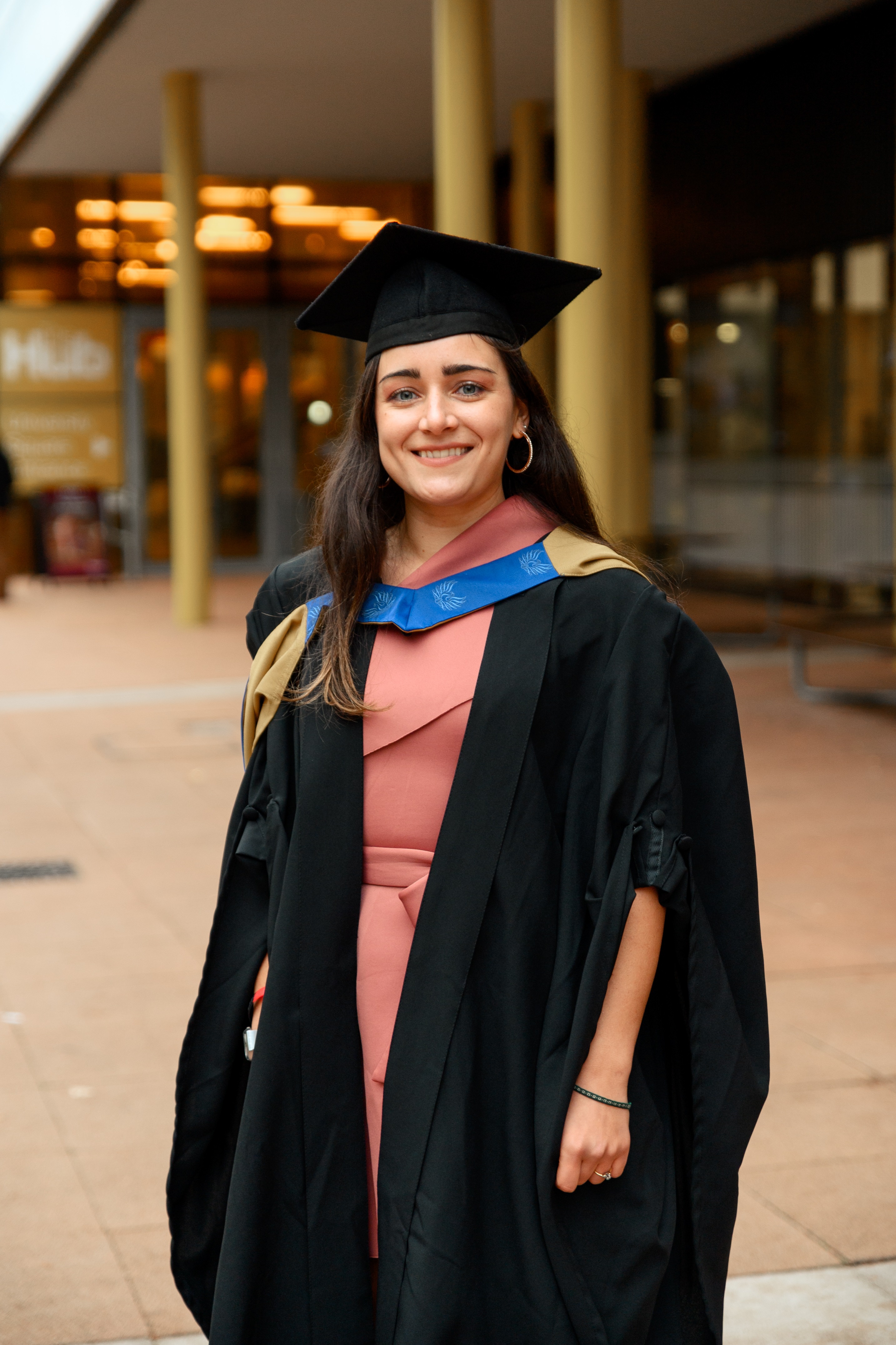 A picture of Emma Vizzino wearing graduation robes A picture of Emma Vizzino wearing graduation robes