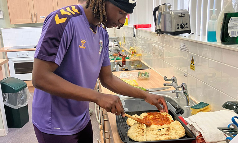 Coventry City FC Academy players learning about cooking and nutrition with Coventry University's Sports and Exercise Nutrition course leaders