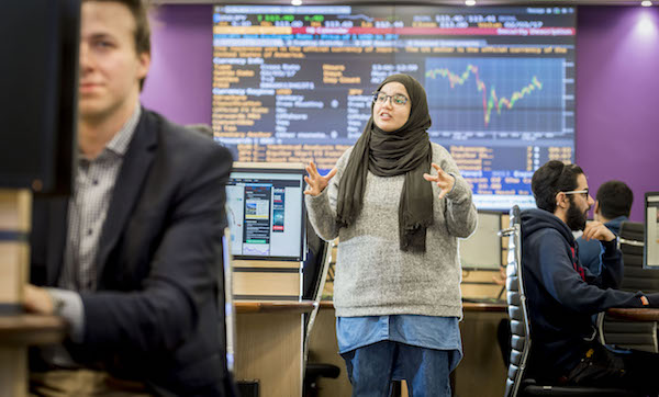 Man and Woman on Coventry University Trading Floor
