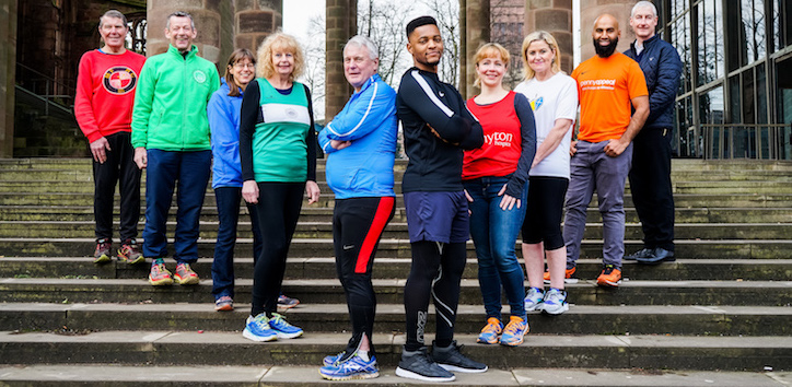 A group of people dressed for a half marathon at the Coventry Cathedral