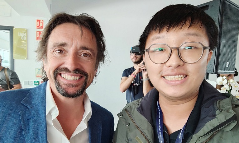 Two men posing one wearing glasses and the other one being Richard Hammond