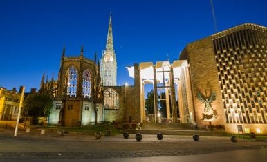 The Cathedral Church of Saint Michael, commonly known as Coventry Cathedral pictured at night aluminated by lights