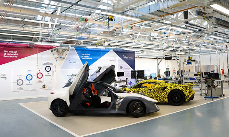 Two cars inside the newly relaunched Institute for Advanced Manufacturing and Engineering