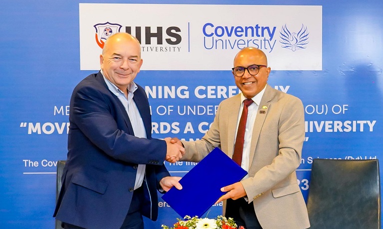 Professor John Latham, CBE, Vice-Chancellor and CEO of Coventry University Group, and Dr Kithsiri Edirisinghe CEO and Co-Founder of the International Institute of Health Sciences celebrate signing a Memorandum of Understanding
