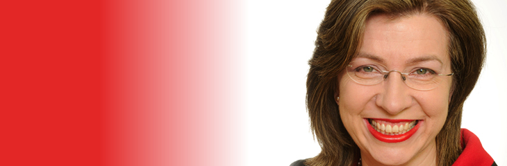 A portrait of Professor Rosalind Searle with a red and white background