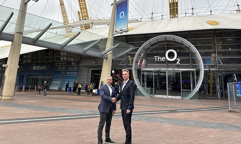Two men shaking hands outside of the O2 arena