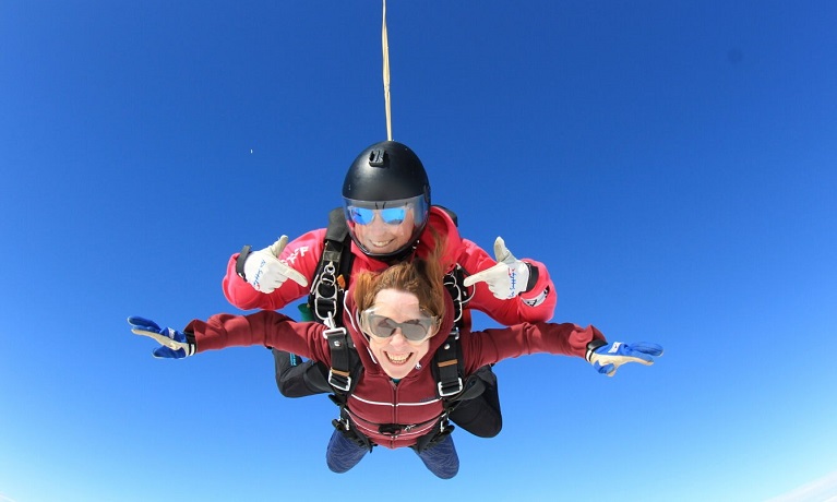 Two people performing a tandem sky dive