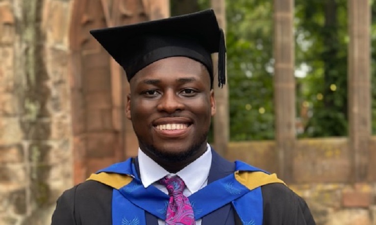 A picture of a student in their graduation robes