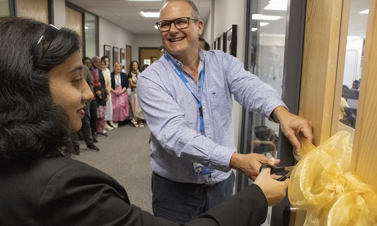 Richard Dashwood, Coventry University Deputy Vice-Chancellor (Research), and Dr Rafia Mumtaz, Professor at NUST, prepare to cut a yellow ribbon to officially open two new laboratories in Coventry