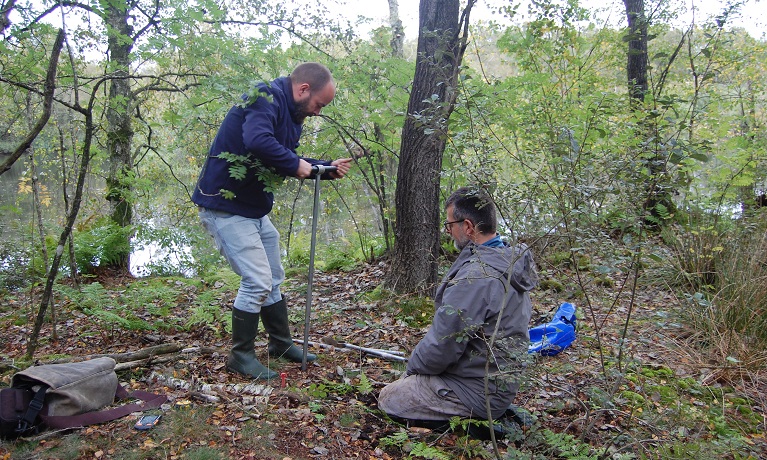 Two men with digging tools