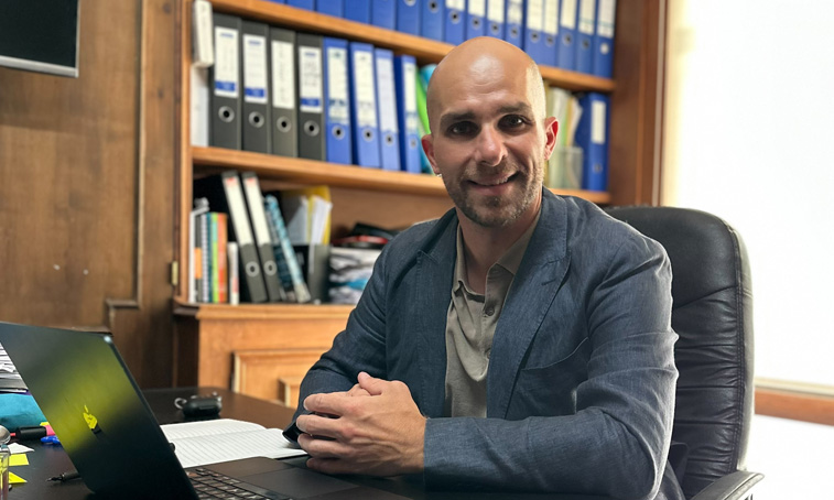 Alejandro Jurado sat behind his desk with a laptop open in front of him