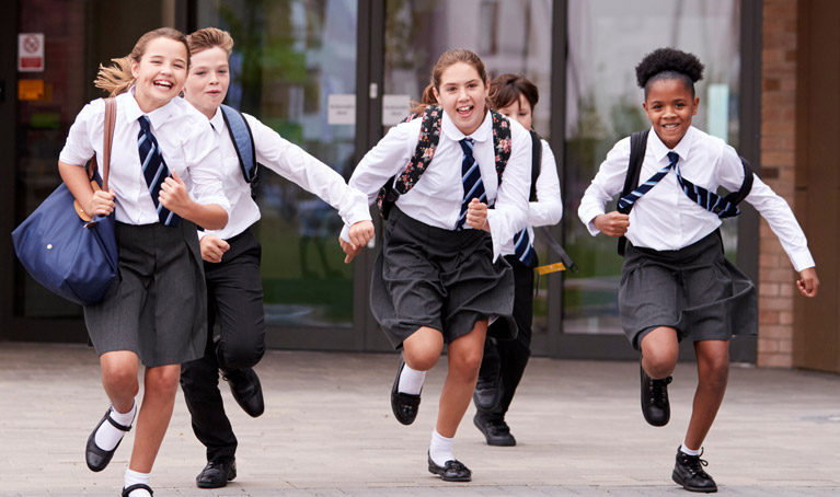 Schoolchildren running outside.