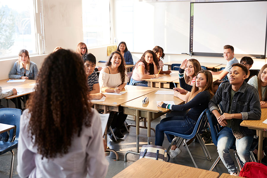 woman presenting to a classroom