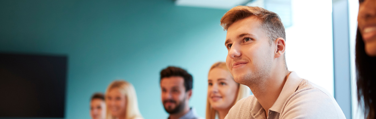 A group of learners in a classroom.